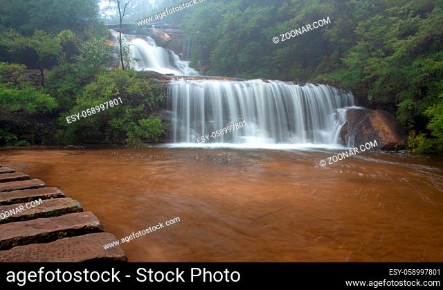Beautiful cascading waterfall in Blue Mountains with stone stepping stones