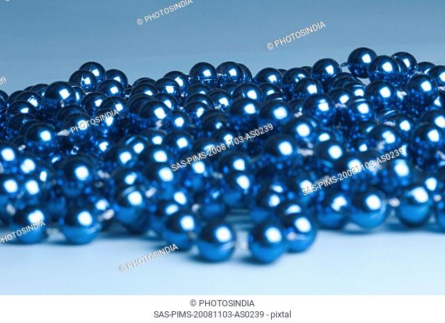 Close-up of a string of blue beads