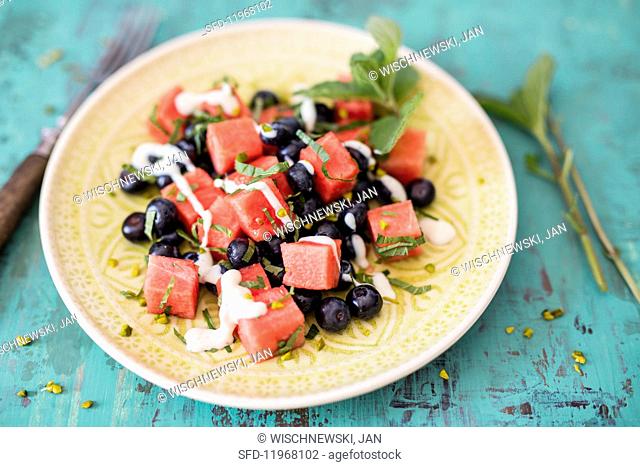 Watermelon with blueberries, mint, pistachios and silken tofu cream