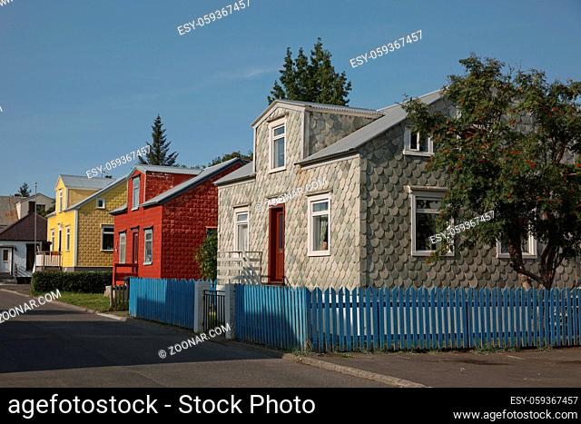 Traditional colourful houses covered in stone tiles or corrugated iron in the old part of Akureyri, Iceland