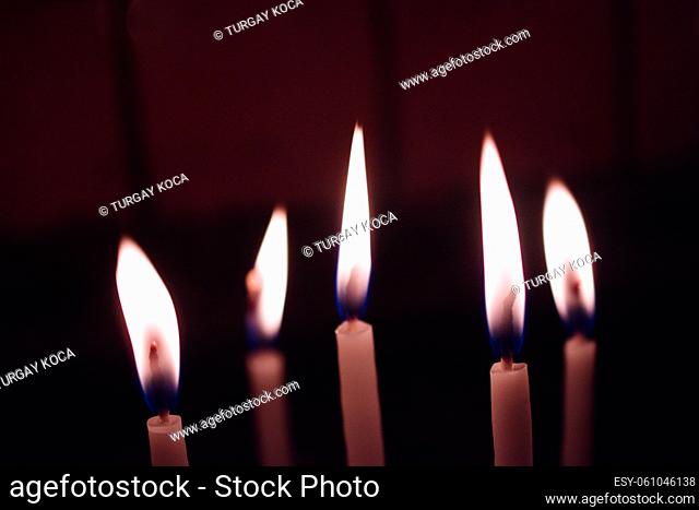 Candle lights in the darkness. Abstract candles background. Hope, fire