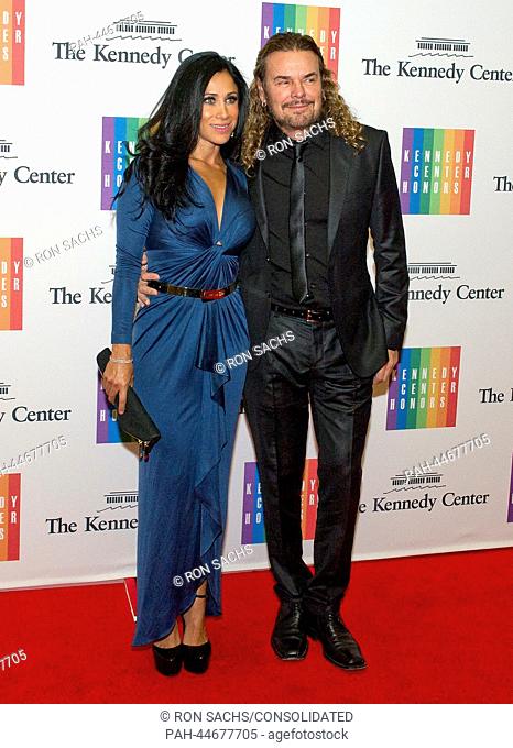Fher Olvera and Monica Noguera Flores arrive for the formal Artist's Dinner honoring the recipients of the 2013 Kennedy Center Honors hosted by United States...