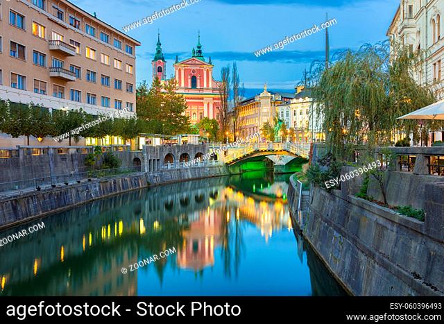 Romantic Ljubljana city center. River Ljubljanica, Triple Bridge - Tromostovje, Preseren square and Franciscan Church of the Annunciation