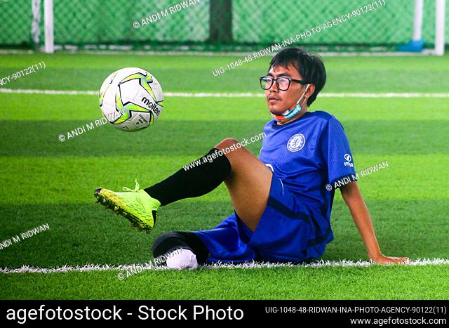 Indonesian amputees football player take part in a training session in a field in Bogor on January 9, 2022. The exercise was carried out as a means of...