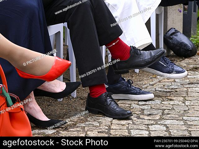 30 June 2023, Brandenburg, Potsdam: Mike Schubert, Lord Mayor of the state capital Potsdam, wears red socks with the inscription ""Potsdam Liebe"" at the...