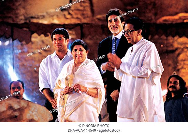 South Asian Indian cricketer Sachin Tendulkar ; singer Lata Mangeshkar ; actor Amitabh Bachchan and politician  Bal Thackeray at a function ; Bombay Mumbai  ;...