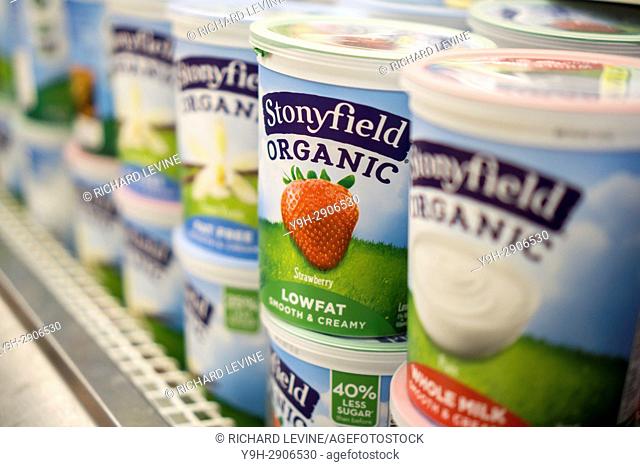 Containers of Stonyfield Farm organic yogurt in a supermarket cooler in New York