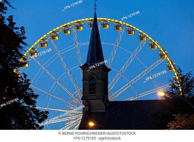 church and Ferris wheel at night, Luxembourg