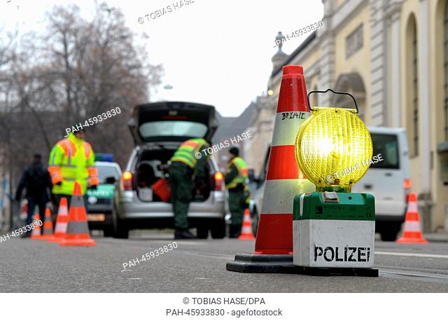 Police officers prepare for the start of the 50th Munich Security Conference near the Bayerischer Hof Hotel in Munich,  Germany, 31 January 2014