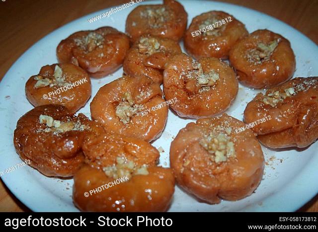 Delicious and tasty Asian sweet dish called balu shahi or baloshahi or balushahi. This dish is street sweet found in Pakistan India and Bangladesh and served in...