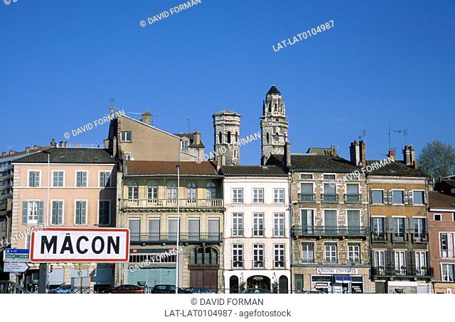 Town. Large sign. Eglise Vieux Saint-Vincent. Two stone towers. Historic houses