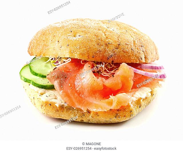 sandwich with smoked salmon, onions and cucumber isolated on white background