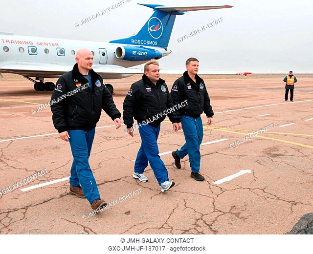 The Expedition 3839 backup crew members arrive at the Baikonur, Kazakhstan airport Oct. 26 after flying from their training base at the Gagarin Cosmonaut...