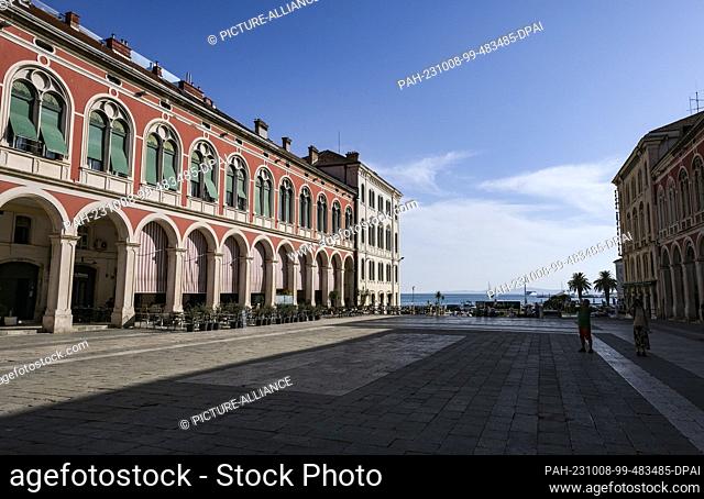 PRODUCTION - 19 September 2023, Croatia, Split: Prokurativa Square, also called Republic Square, is surrounded on three sides by Neo-Renaissance style buildings...