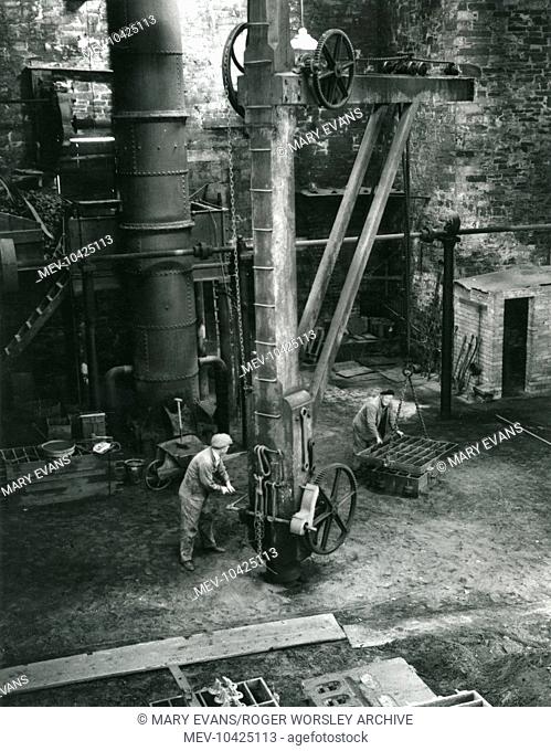 General view of the foundry at Dinorwig (or Dinorwic) Slate Quarry, near Llanberis, North Wales, with two men at work