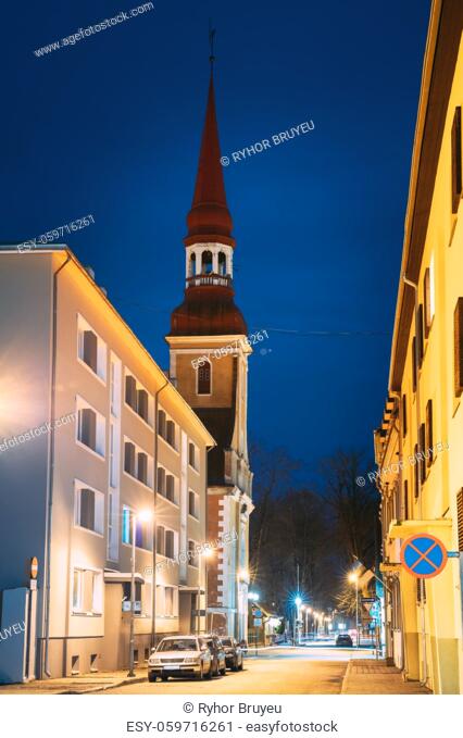 Parnu, Estonia. Night View Of Nikolai Street With Old Houses, Restaurants, Cafe, Hotels And Shops In Evening Night Illuminations