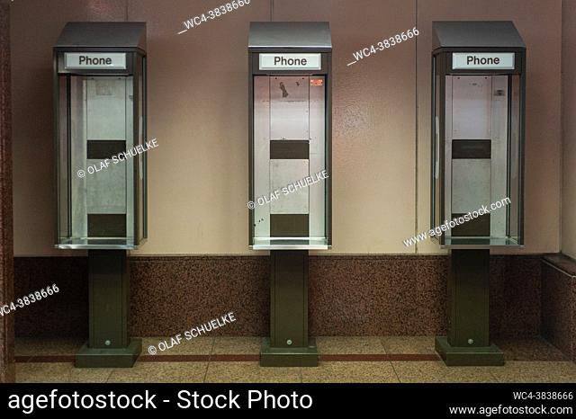 Singapore, Republic of Singapore, Asia - Old, inoperative public payphone booths without phones at an underpass