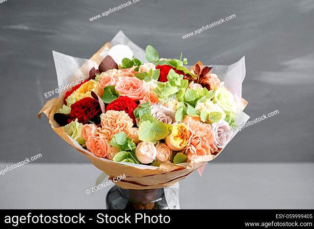 beautiful bouquet made of different flowers on grey background. colorful color mix flower