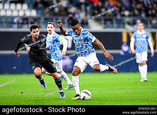 OHL's Florian Miguel and Gent's Gift Emmanuel Orban pictured in action during a soccer match between KAA Gent and OH Leuven, Thursday 21 December 2023 in Gent