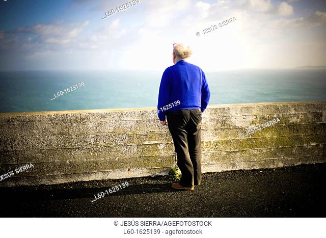 Old man looking the sea, Ortegal cape, A Coruña, Galicia, Spain