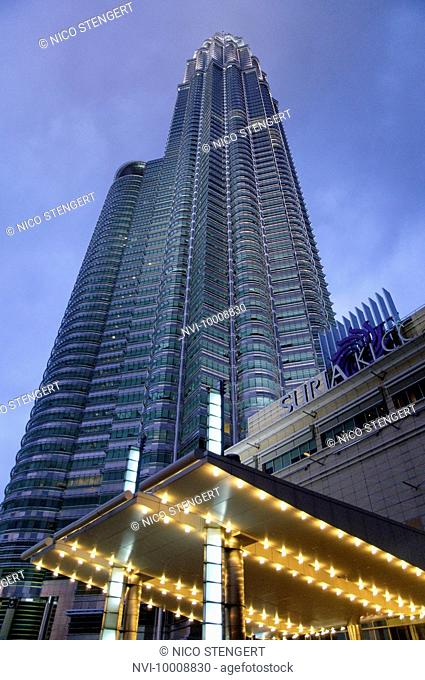 Petronas Twin Towers and Suria KLCC shopping centre illuminated in the evening, Kuala Lumpur, Malaysia, Southeast Asia, Asia