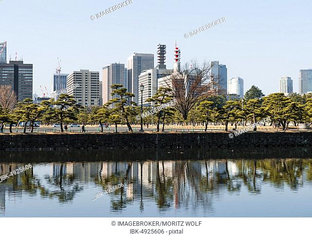 High-rise buildings reflected in a canal, downtown Toyko, Chiyoda-ku, Tokyo, Japan, Asia