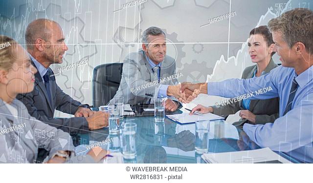 Business meeting with behind gear and chart graphic overlay against grey background