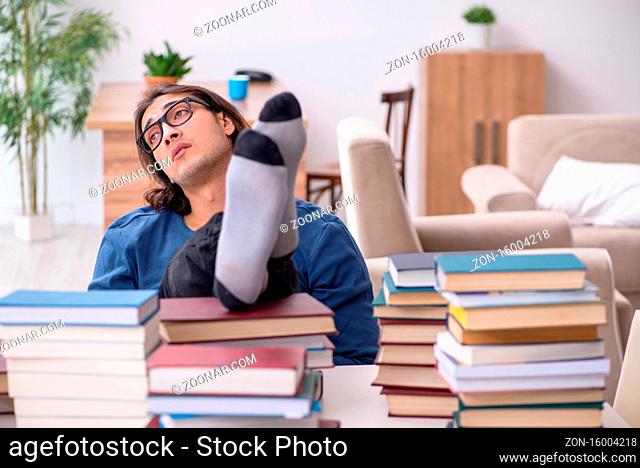 Young student preparing for exams at home