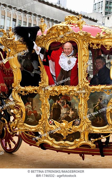 Alderman Michael Bear, the Lord Mayor of London wearing traditional costume waving from the golden state coach, Lord Mayor's Show in the City of London, England
