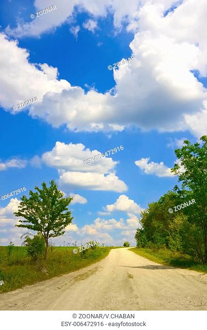Cloudscape over rural road
