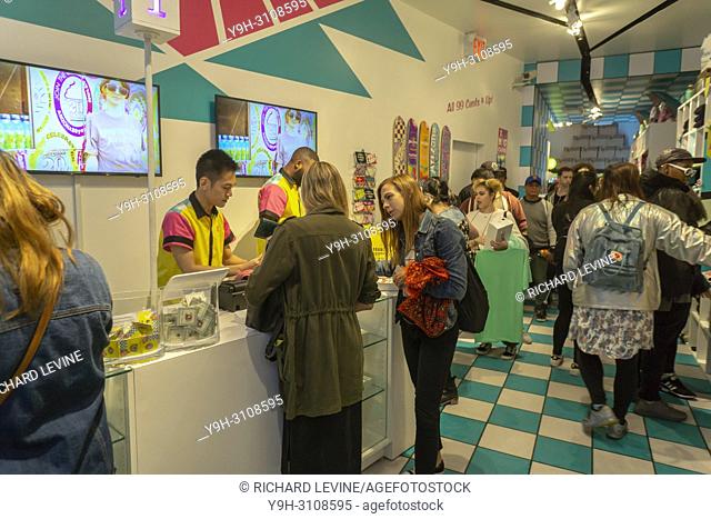 Slow moving check-out line in the AriZona Beverages ""Great Buy 99¢"" pop-up store in Soho in New York on opening day, Wednesday, May 16, 2018