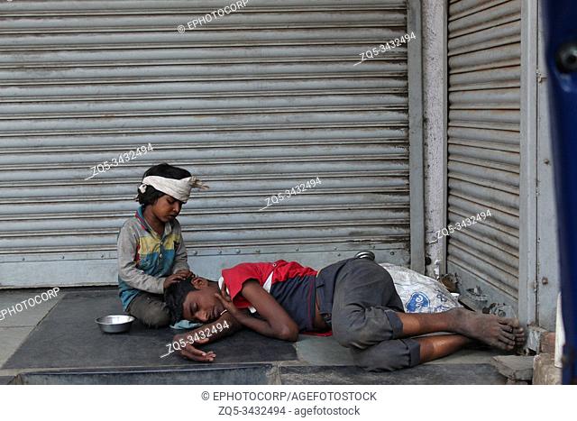 PUNE, MAHARASHTRA, INDIA, March 2019, Street kids resting, Pune, Maharashtra