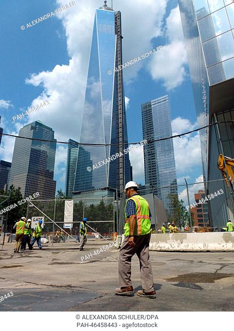 Construction workers are pictured in front of the One World Trade Center in New York City, USA, 20 August 2013. The skyscraper is built since 2006 at Ground...