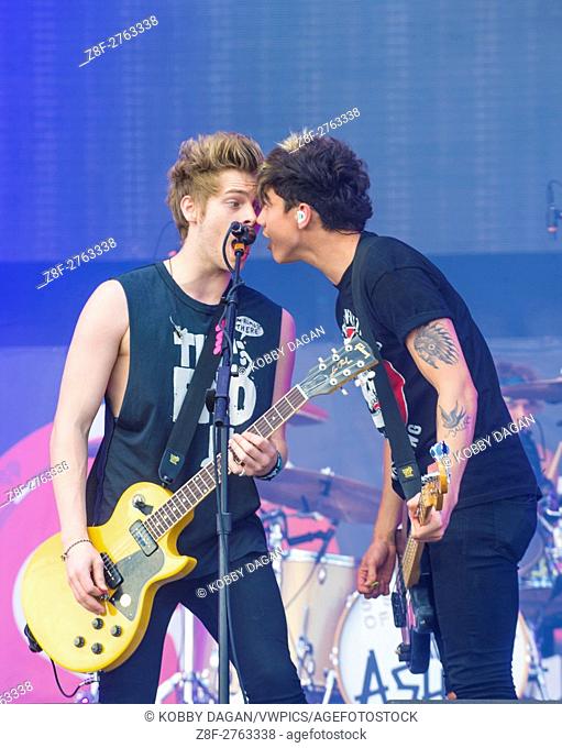 Rock band 5 Seconds of Summer performs on stage at the 2014 iHeartRadio Music Festival Village in Las Vegas