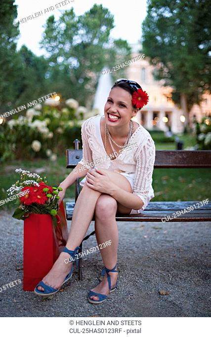Young woman on park bench