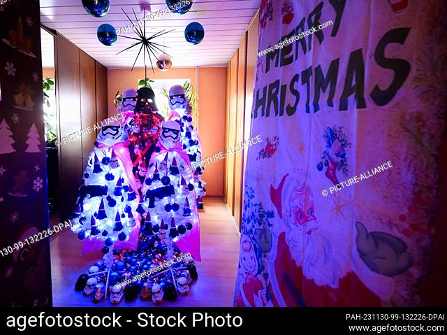 30 November 2023, Lower Saxony, Rinteln: Christmas trees with a Star Wars look in the Jeromin family home in the Schaumburg district
