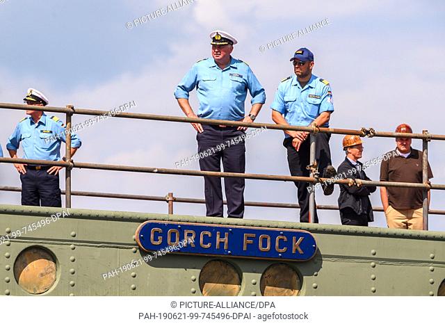 21 June 2019, Bremen, Bremerhaven: Crew members stand at the dock of the naval training sailboat ""Gorch Fock"". The naval training ship ""Gorch Fock"" is being...