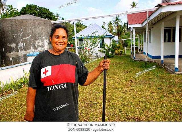 Local woman cleaning church yard, Ofu island, Vava