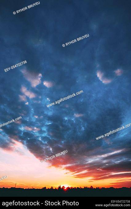 Sunset, Sunrise Over Forest. Bright Dramatic Sky And Dark Ground. Countryside Landscape Under Scenic Summer Dramatic Sky In Sunset Dawn Sunrise