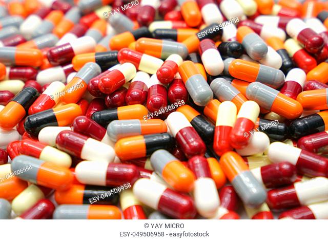 Orange, black, grey, white, red, pale yellow, capsule pills