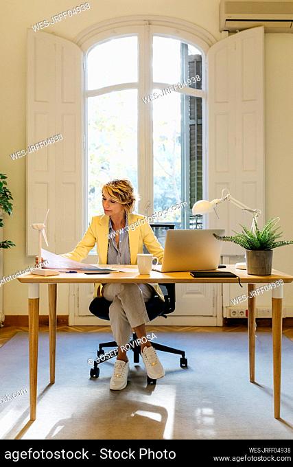 Businesswoman with concentration working in office