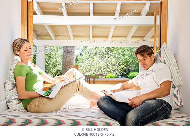 Couple relaxing together in nook