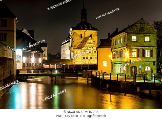 Lights in the centre of Bamberg, Germany, are reflected in the water of the river Regnitz during the night from 07.12. to 08.12.2015