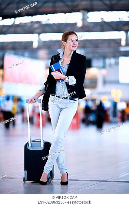 Pretty young female passenger at the airport