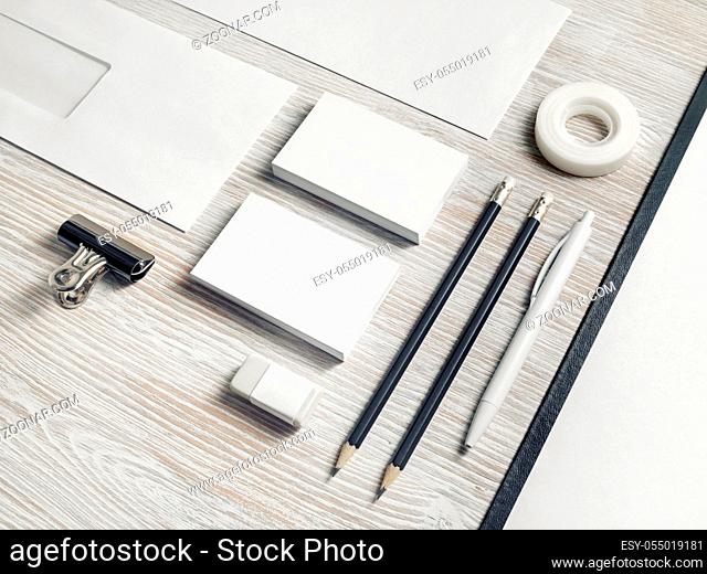 Blank corporate identity. Stationery template on light wood table background. Branding mockup