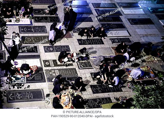 29 May 2019, Iran, Tehran: Iranian Muslim women pray at the Imamzadeh Eynali and Zeynali Shrine to commemorate 'Laylat al-Qadr' or the Night of Decree