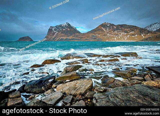 Rocky coast of fjord of Norwegian sea in winter. Lofoten islands, Norway
