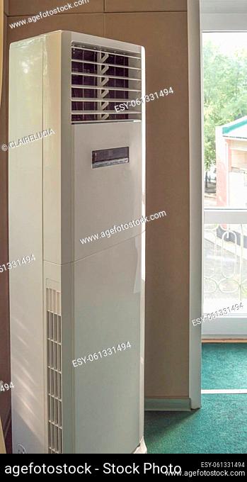 Vertical split system column air conditioner close-up for office, industrial premises and gyms