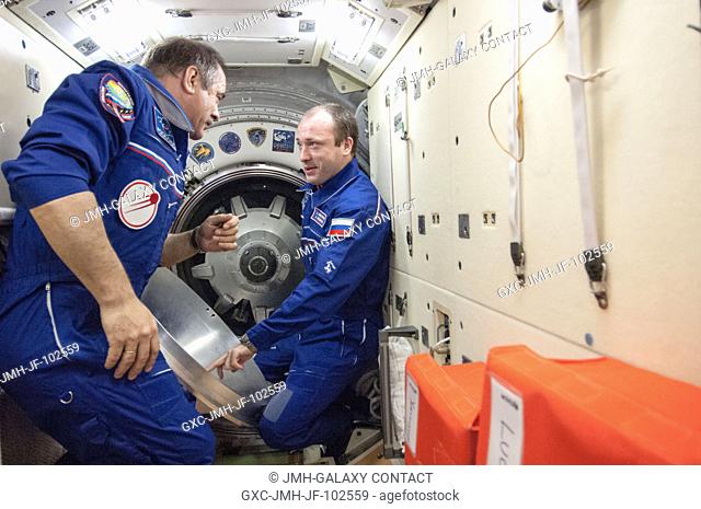 Like hosts standing in a parlor waiting for company on the way, Expedition 36 Commander Pavel Vinogradov (left), and Flight Engineer Alexander Misurkin