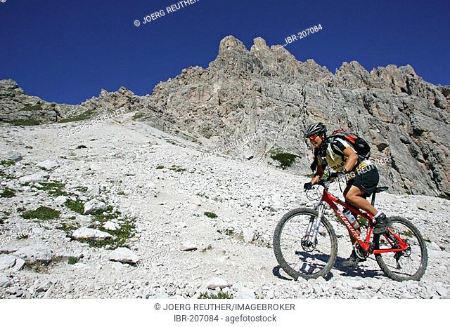 Biker at the Croda da Lago, Dolomites, Italy
